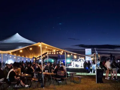 Rental beduin tent for festivals and summer universities, set with festive lighting.